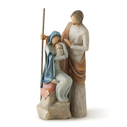 A hand-painted nativity figure set depicting the Holy Family, with Joseph, Mary, and baby Jesus on a stone base.