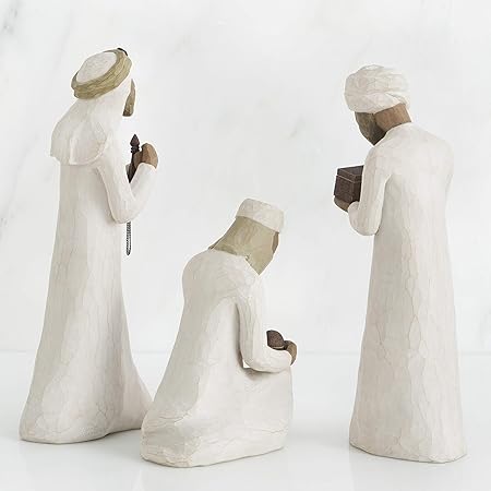 Three stone statues of people in prayer positions on a white background